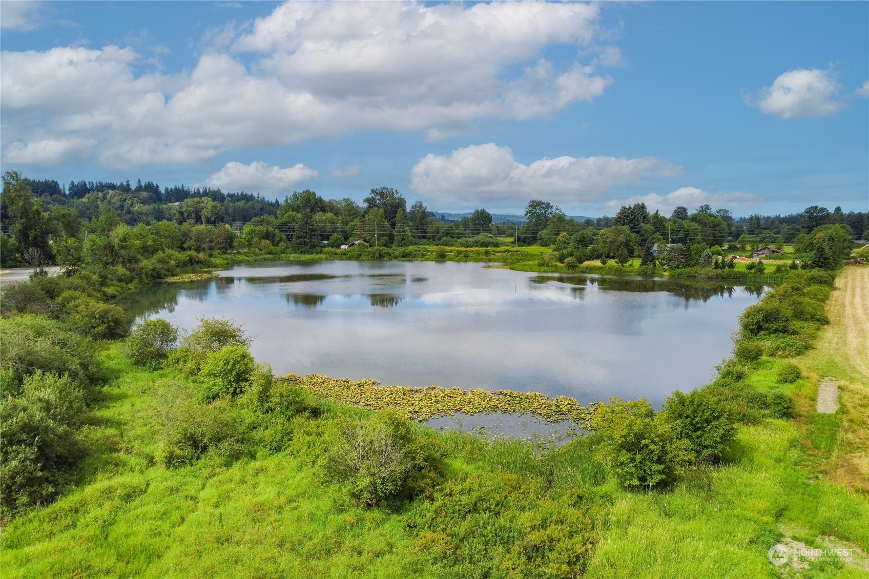 0 Southwest Hillburger Road Chehalis, WA 98532 - Photo 2 of 16 a view of a lake with houses in the back