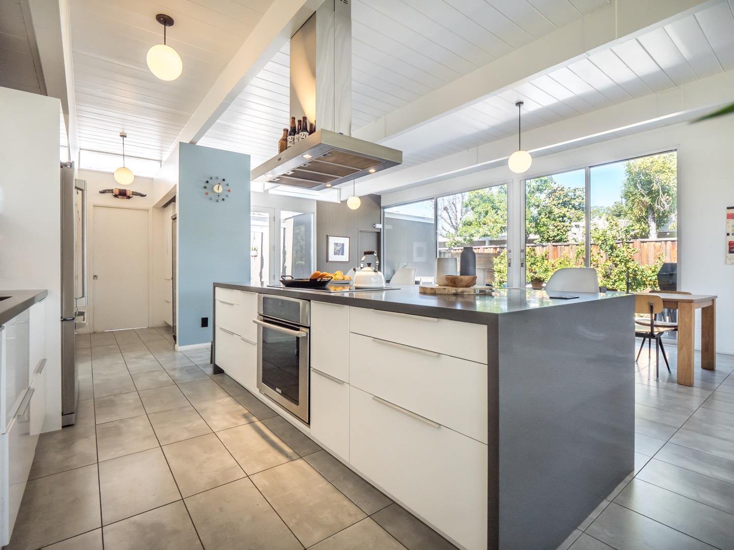3449 Thomas Drive Palo Alto, CA 94303 - Photo 13 of 59 a kitchen with stainless steel appliances granite countertop a refrigerator and a sink