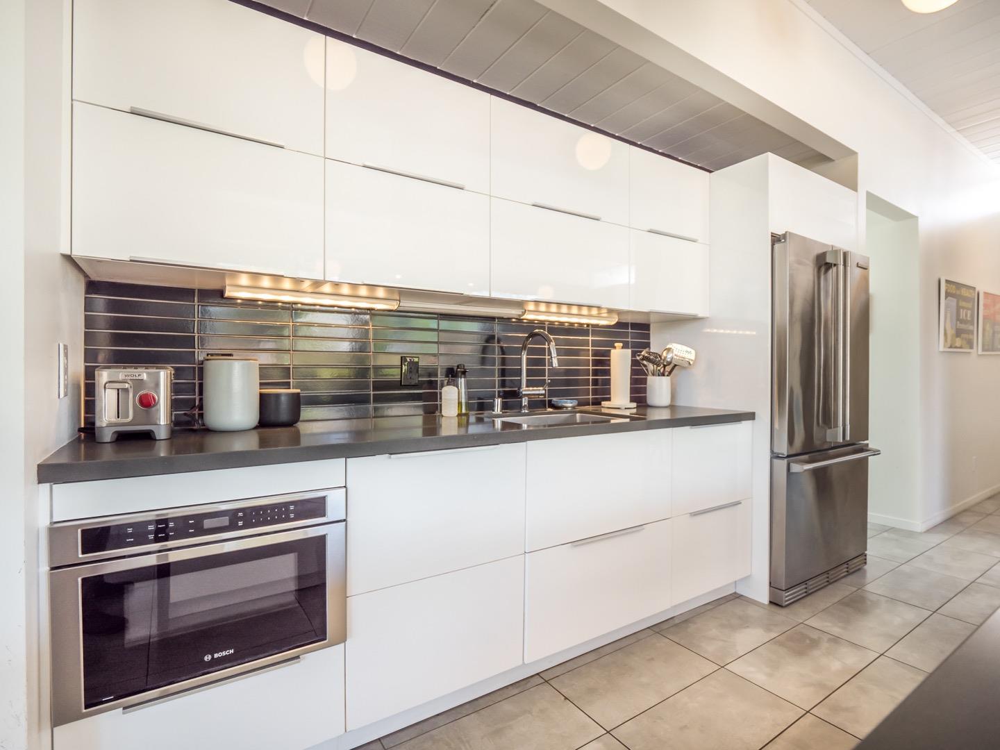3449 Thomas Drive Palo Alto, CA 94303 - Photo 14 of 59 a kitchen with stainless steel appliances a stove and a refrigerator