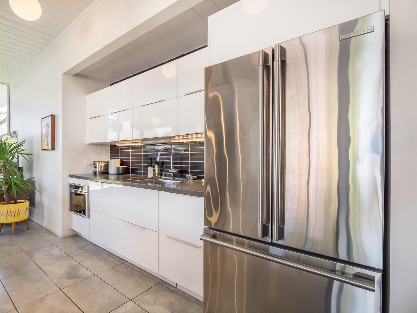 3449 Thomas Drive Palo Alto, CA 94303 - Photo 15 of 59 a kitchen with stainless steel appliances a refrigerator and a sink