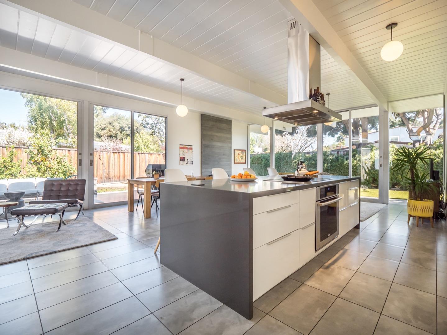 3449 Thomas Drive Palo Alto, CA 94303 - Photo 16 of 59 a kitchen with a large counter top space and stainless steel appliances