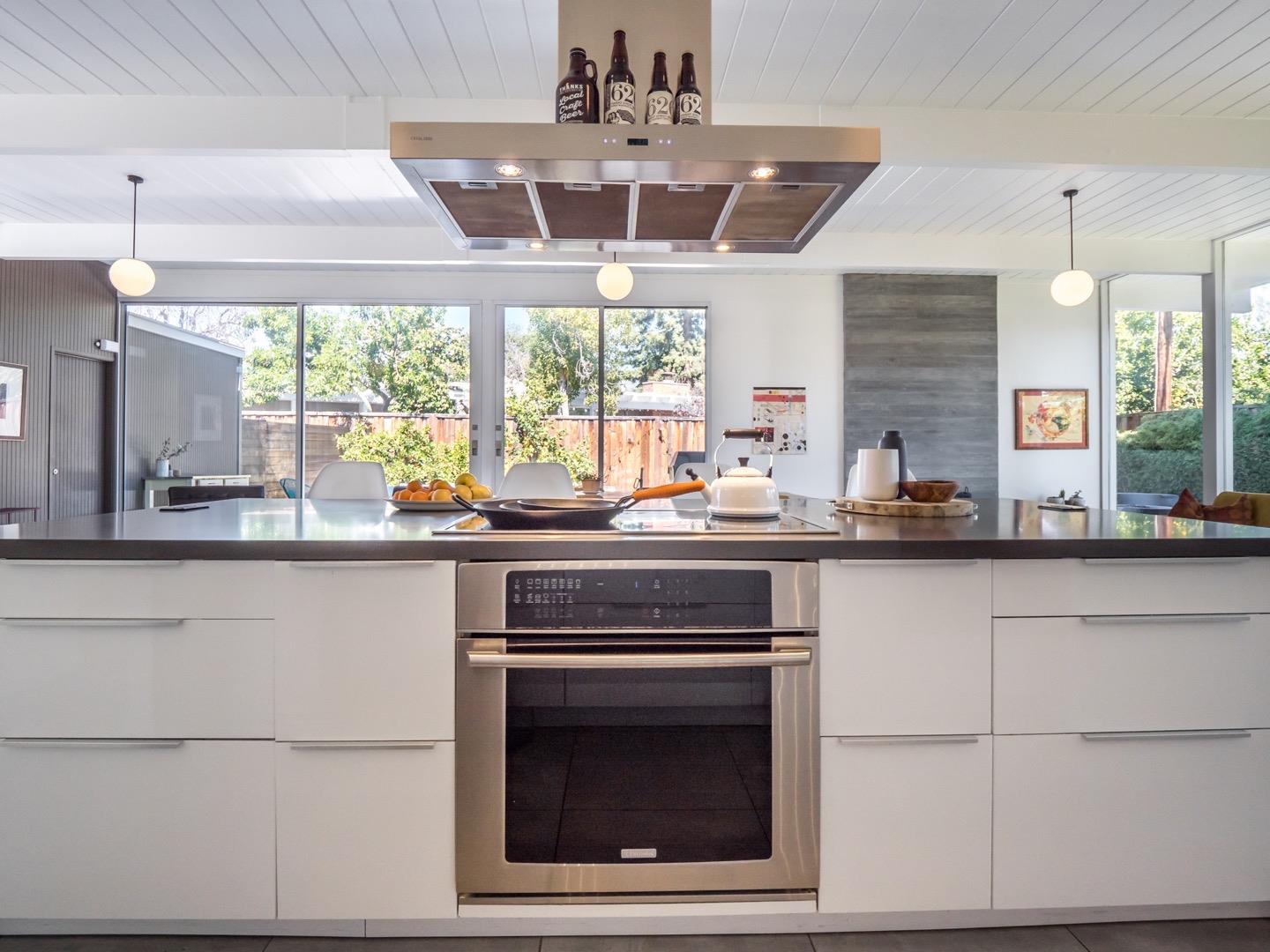3449 Thomas Drive Palo Alto, CA 94303 - Photo 17 of 59 a kitchen with a stove a sink and a refrigerator
