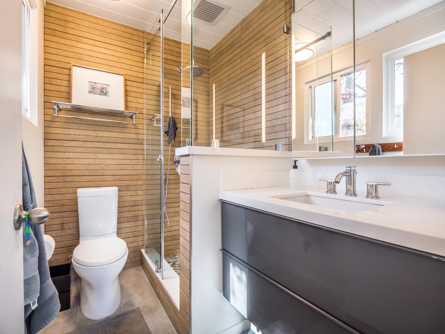 3449 Thomas Drive Palo Alto, CA 94303 - Photo 23 of 59 a bathroom with a toilet sink vanity and mirror