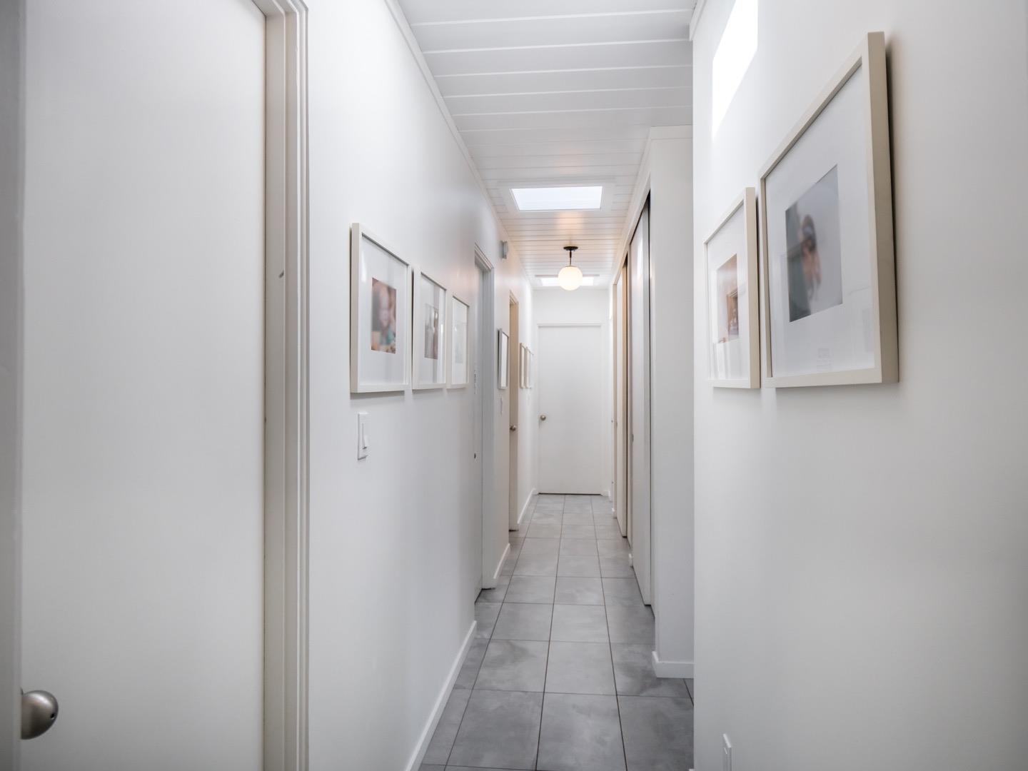 3449 Thomas Drive Palo Alto, CA 94303 - Photo 24 of 59 a view of a hallway with windows