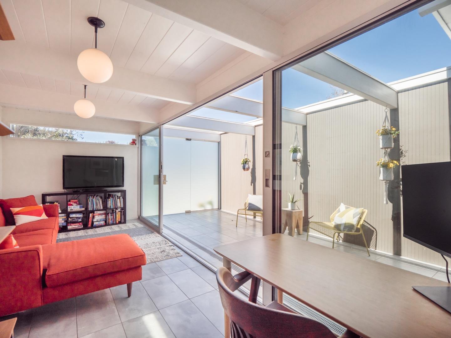 3449 Thomas Drive Palo Alto, CA 94303 - Photo 31 of 59 a living room with furniture and a flat screen tv