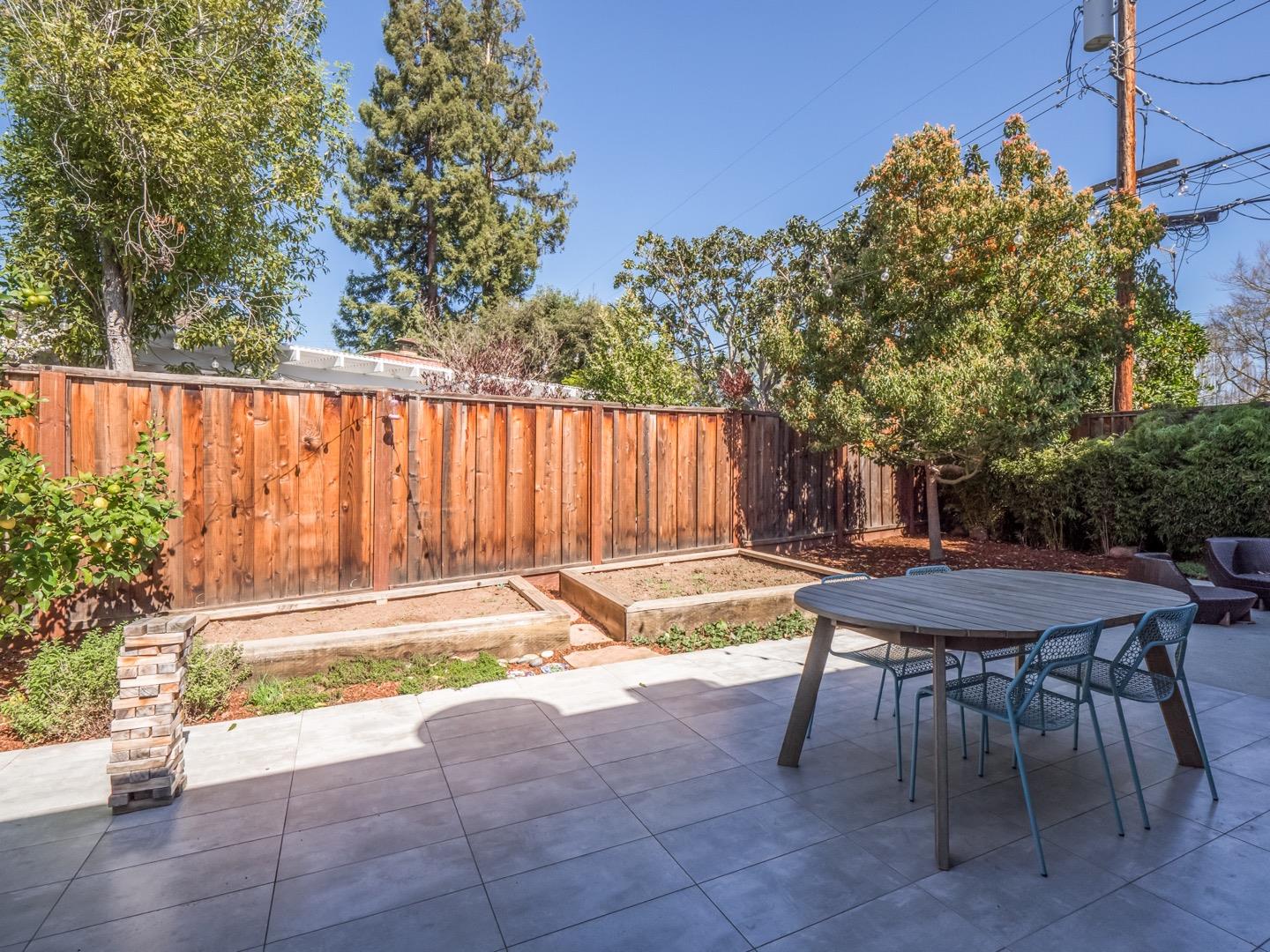 3449 Thomas Drive Palo Alto, CA 94303 - Photo 41 of 59 a view of backyard with a table and chairs and potted plants