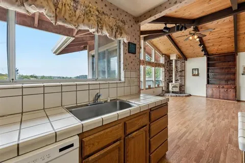 a kitchen with a sink and cabinets
