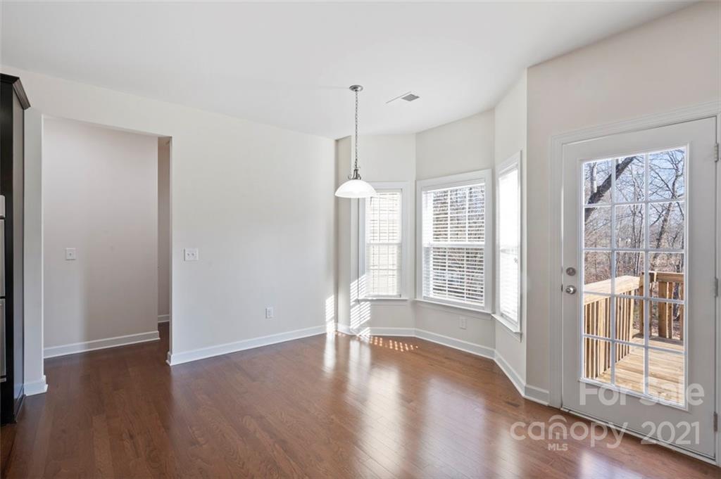 4331 Oxford Mill Road Waxhaw, NC 28173 - Photo 15 of 48 a view of empty room with wooden floor and fan
