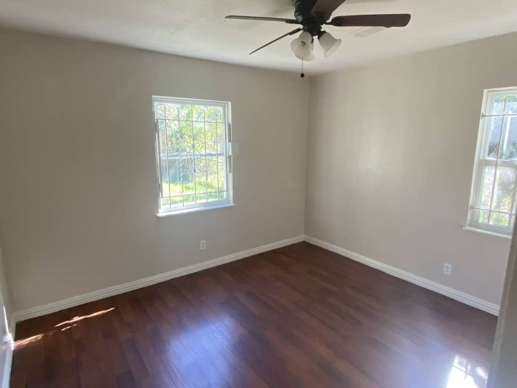 5131 Nassau Road Houston, TX 77021 - Photo 11 of 14 wooden floor in an empty room with a window