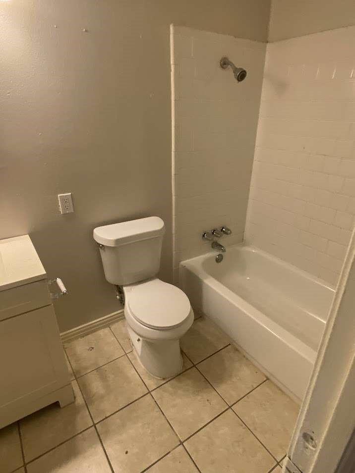 5131 Nassau Road Houston, TX 77021 - Photo 12 of 14 a bathroom with a toilet and a shower