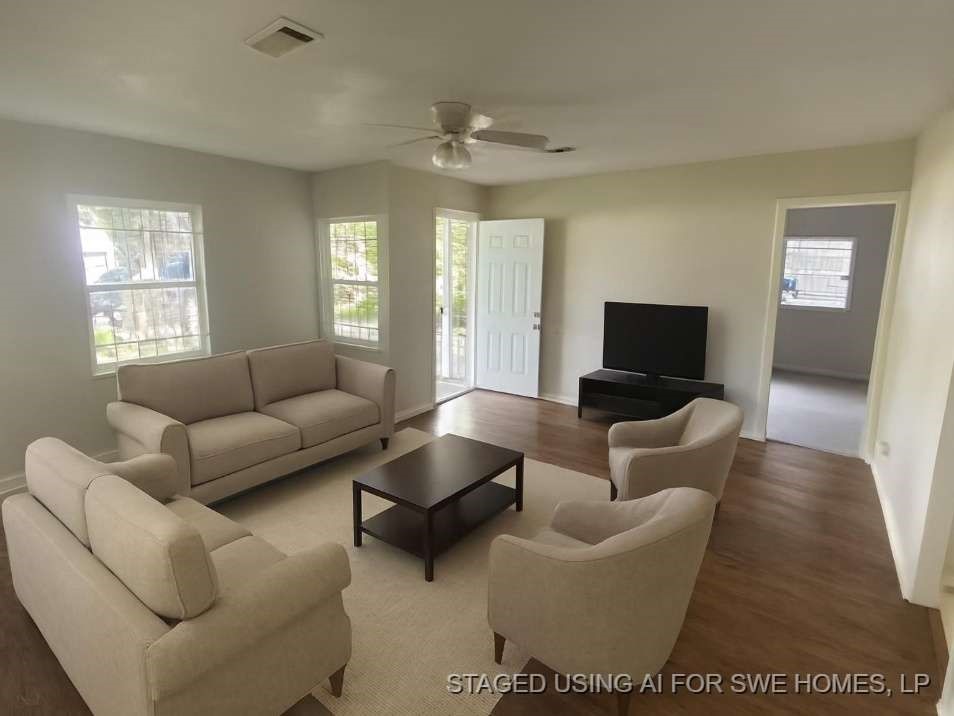 5131 Nassau Road Houston, TX 77021 - Photo 3 of 14 a living room with furniture and a flat screen tv