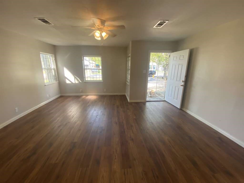 5131 Nassau Road Houston, TX 77021 - Photo 4 of 14 a view of an empty room with wooden floor and a window