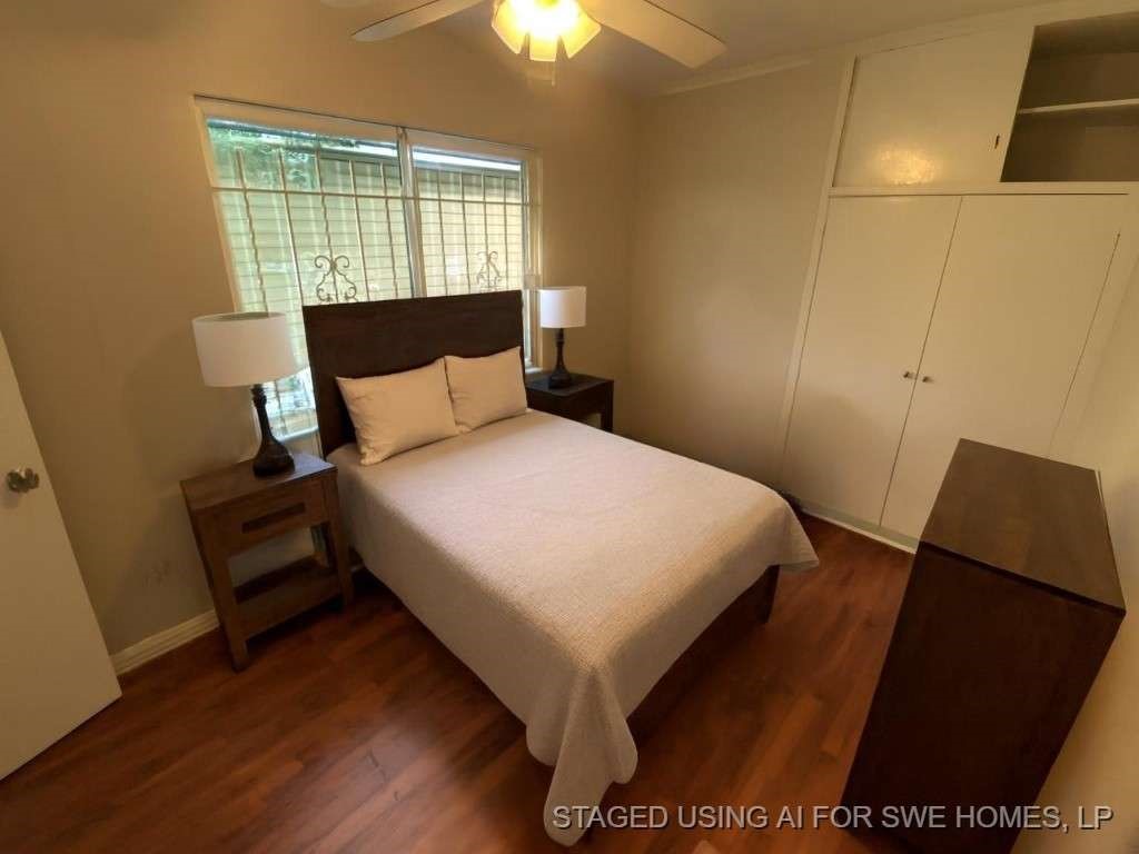 5131 Nassau Road Houston, TX 77021 - Photo 8 of 14 a large bed sitting in a bedroom next to a window