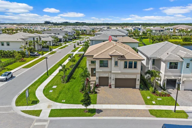 a aerial view of a house with a yard