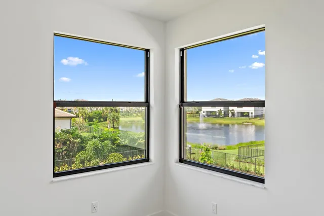 a white bath tub sitting next to a window