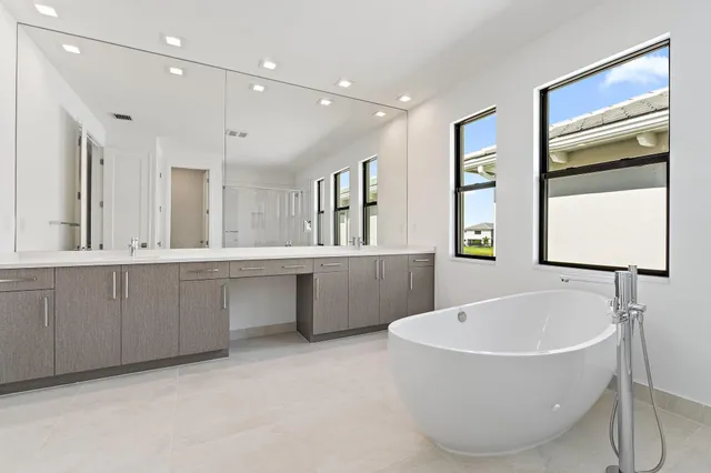 a bathroom with a glass shower door