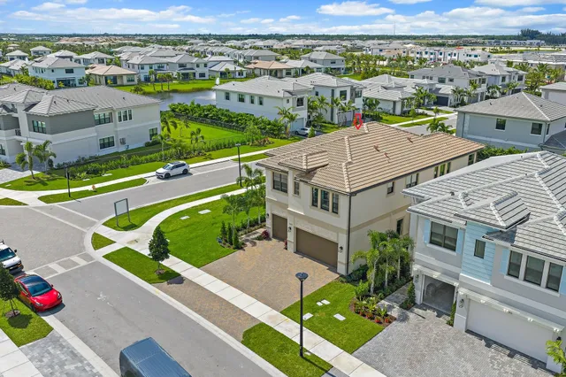 an aerial view of a house with a garden