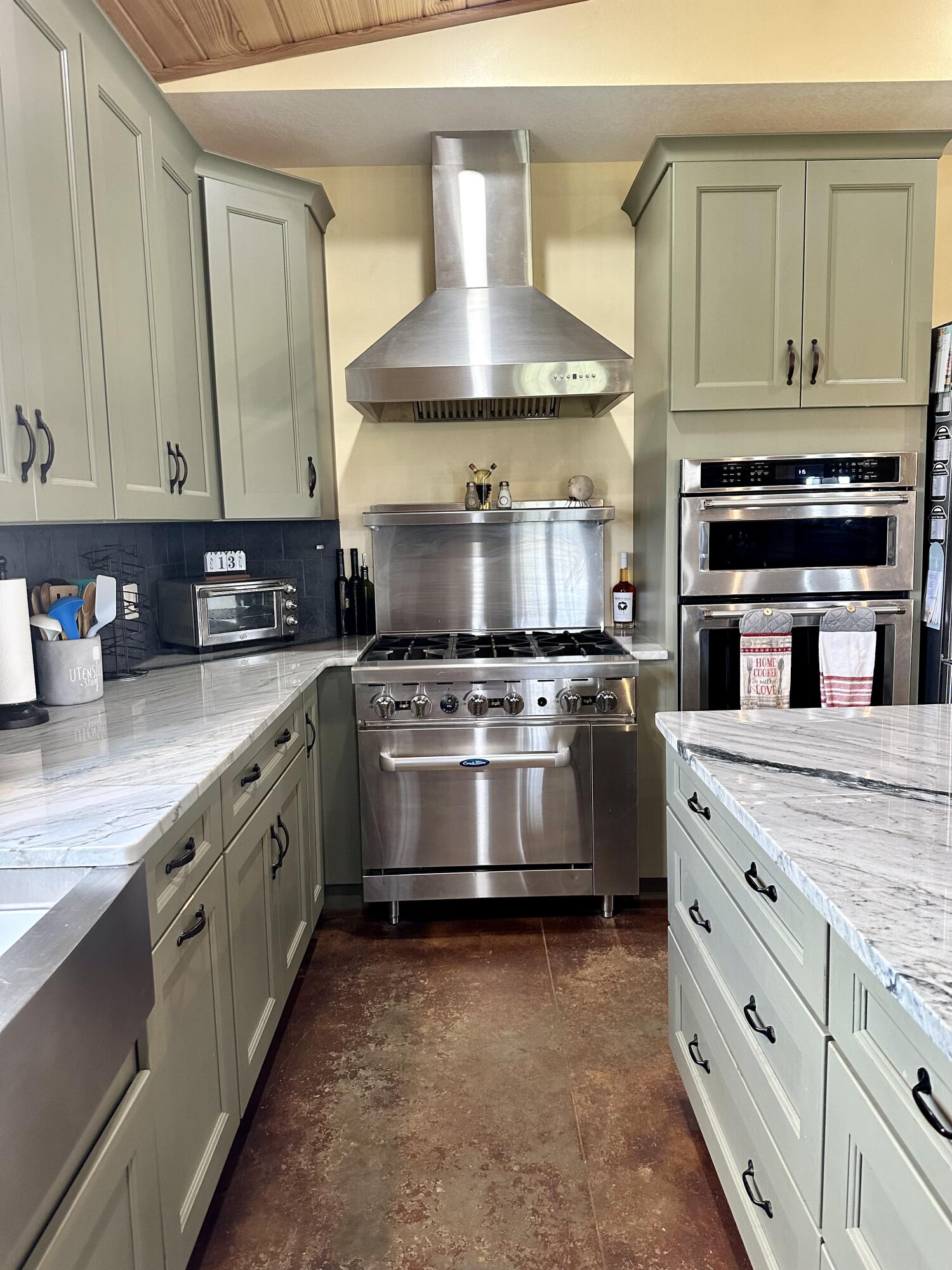 5170 Poplar Head Church Road Holt, FL 32564 - Photo 8 of 35 a kitchen with stainless steel appliances granite countertop a stove and a white cabinets