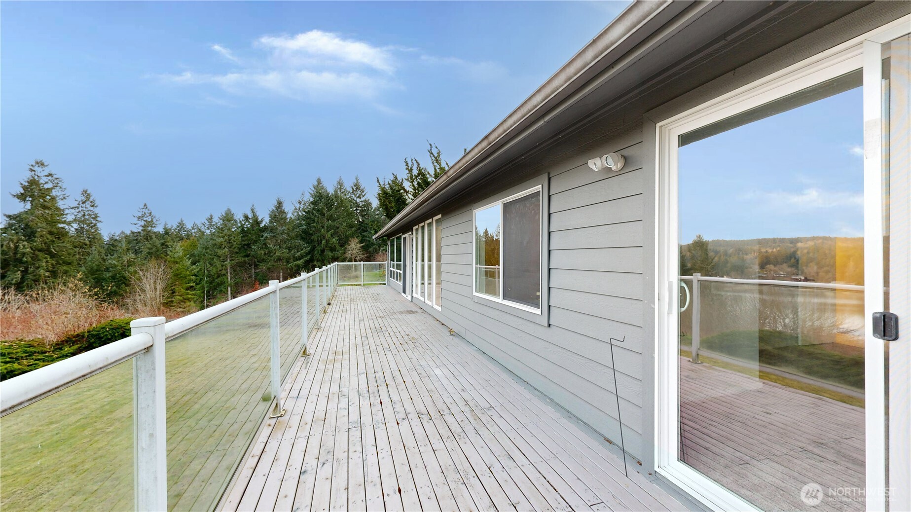 5810 Meridian Road Southeast Olympia, WA 98513 - Photo 11 of 40 a view of a balcony with wooden floor and fence next to a yard