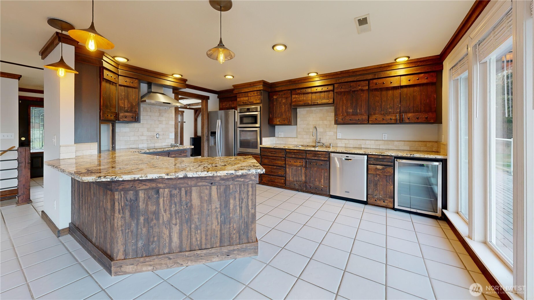 5810 Meridian Road Southeast Olympia, WA 98513 - Photo 20 of 40 a kitchen with stainless steel appliances a sink and a refrigerator