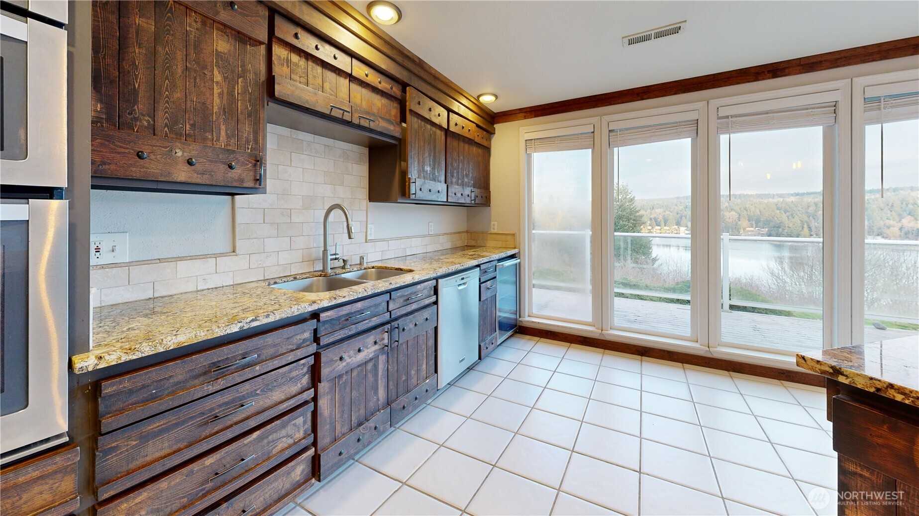 5810 Meridian Road Southeast Olympia, WA 98513 - Photo 21 of 40 a kitchen with stainless steel appliances granite countertop a sink and cabinets