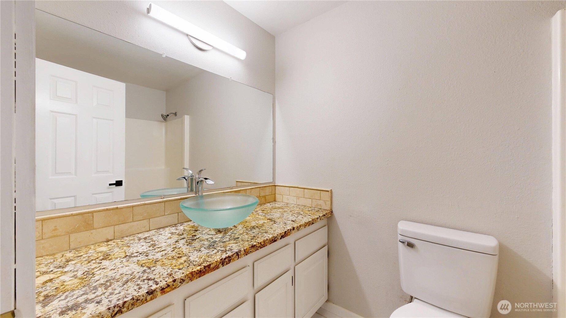 5810 Meridian Road Southeast Olympia, WA 98513 - Photo 28 of 40 a bathroom with a granite countertop sink and a toilet