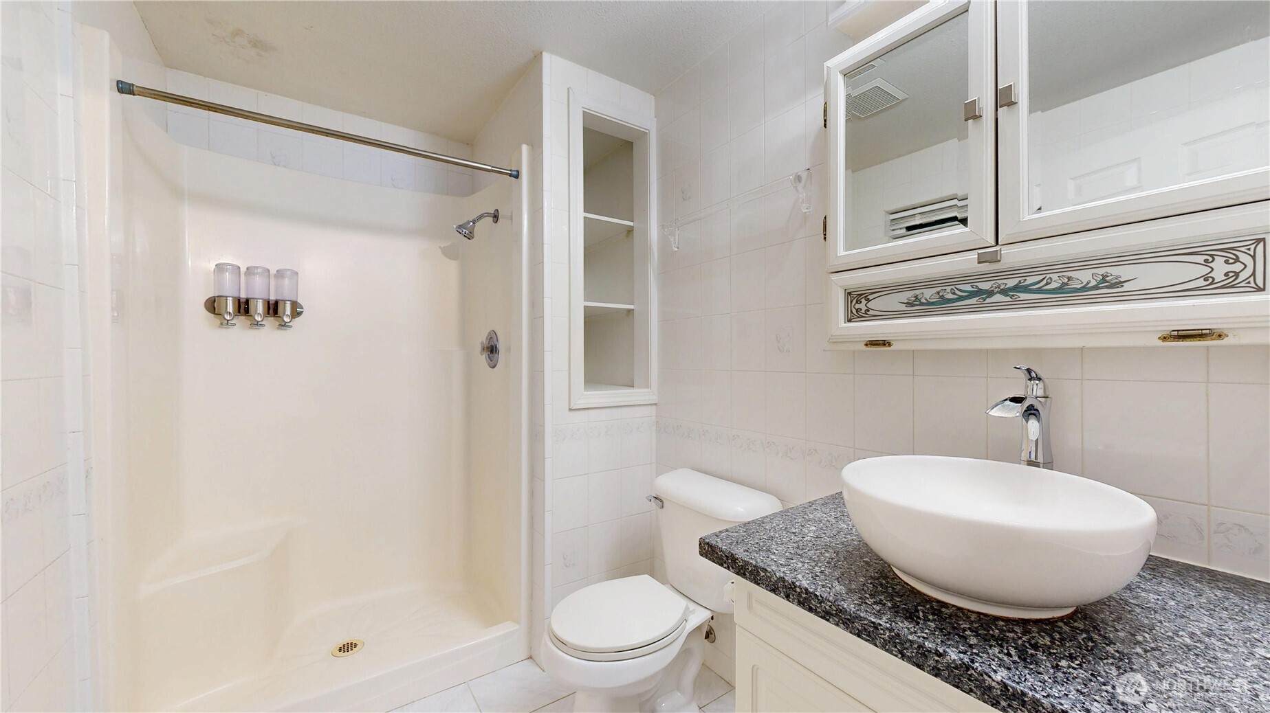 5810 Meridian Road Southeast Olympia, WA 98513 - Photo 36 of 40 a bathroom with a granite countertop sink toilet a mirror and shower