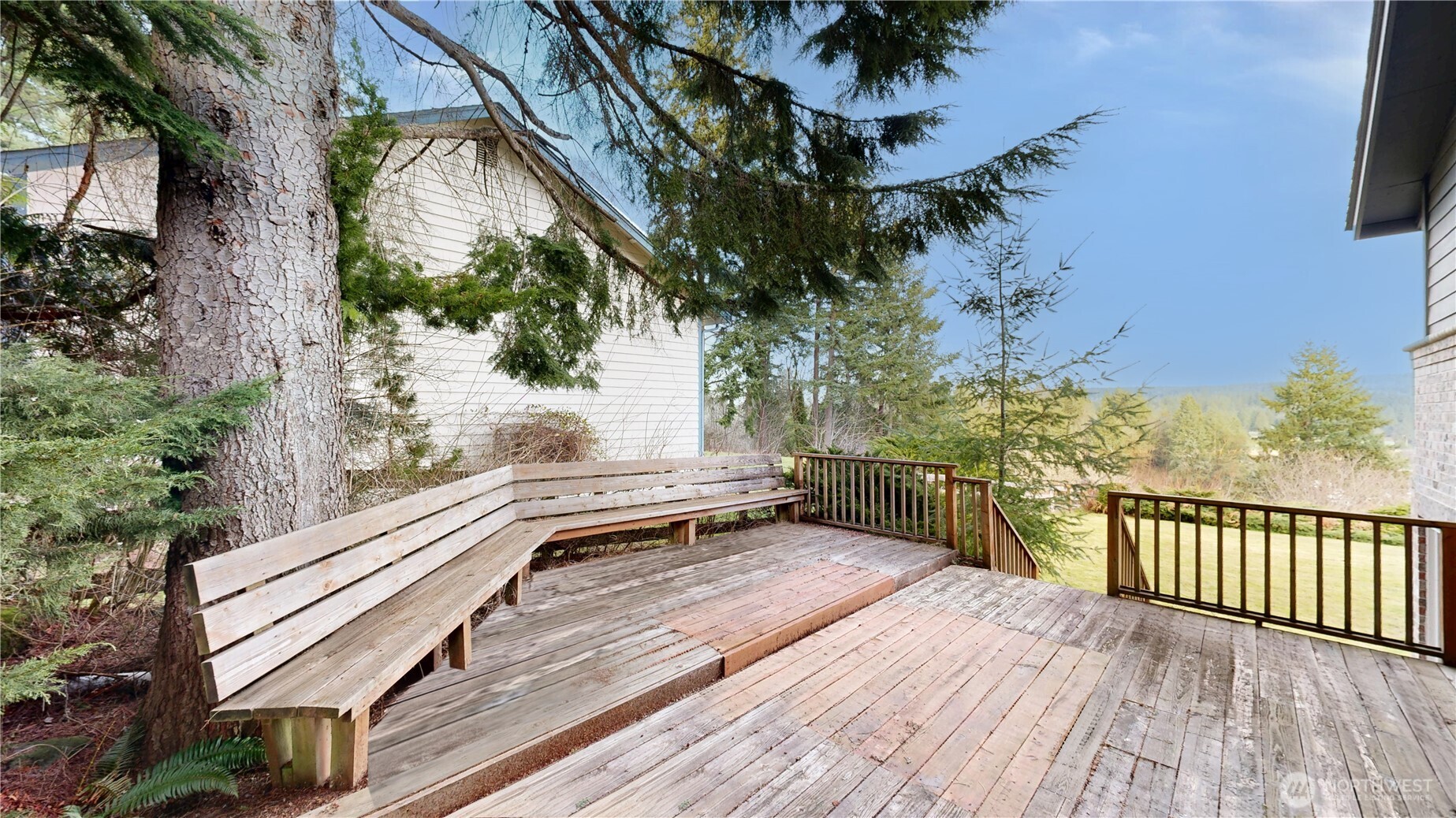5810 Meridian Road Southeast Olympia, WA 98513 - Photo 8 of 40 a view of a balcony with wooden floor and fence