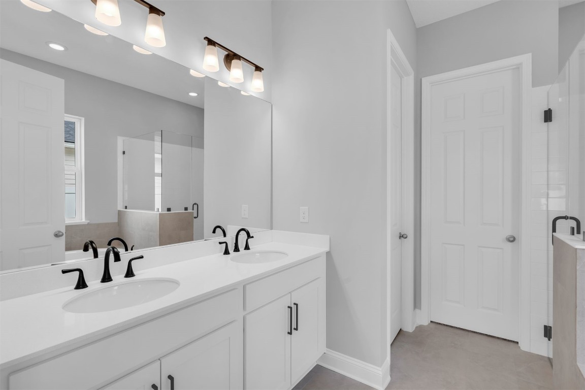 454 Slash Pine Place Yulee, FL 32097 - Photo 19 of 34 a bathroom with a sink a vanity and a mirror