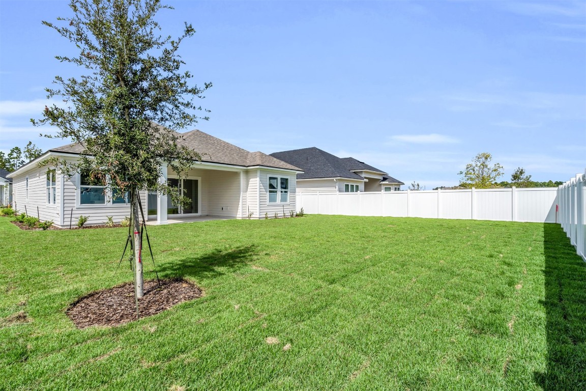 454 Slash Pine Place Yulee, FL 32097 - Photo 25 of 34 a house view with a garden space
