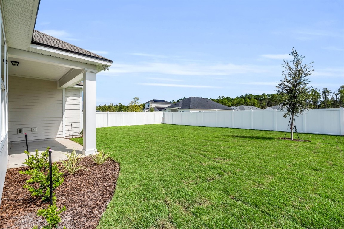 454 Slash Pine Place Yulee, FL 32097 - Photo 26 of 34 a view of a back yard of the house