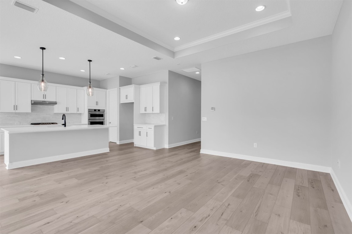 454 Slash Pine Place Yulee, FL 32097 - Photo 10 of 34 a view of kitchen with wooden floor and window