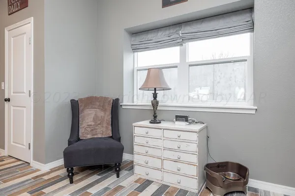 a room with a window and a chair