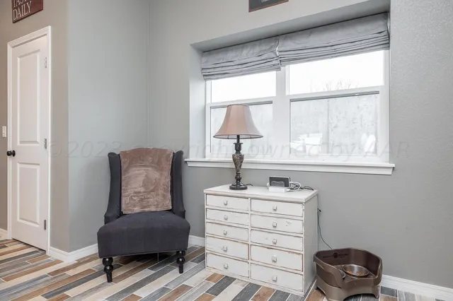 a room with a window and a chair