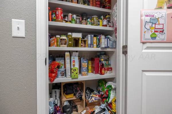 a store room with lots of fruit and vegetables