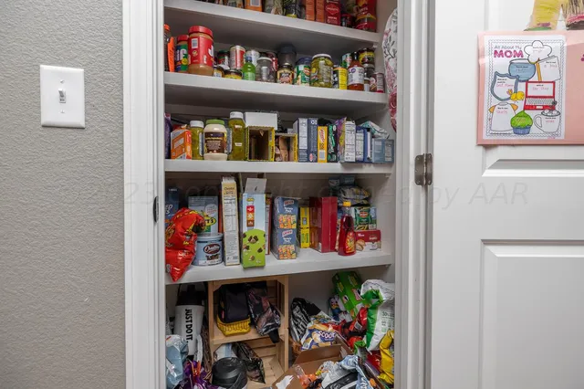 a store room with lots of fruit and vegetables