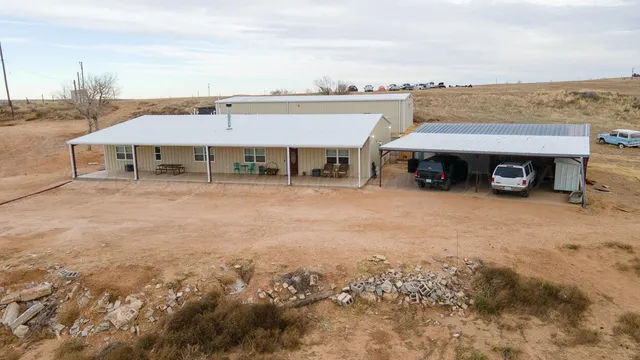 an aerial view of a house with sitting space and balcony