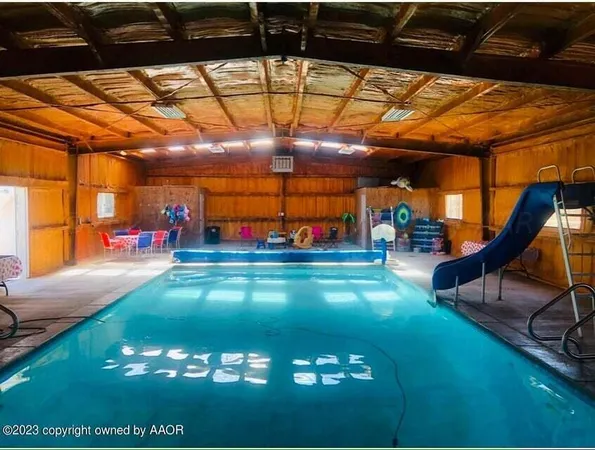 a view of a swimming pool with an outdoor space