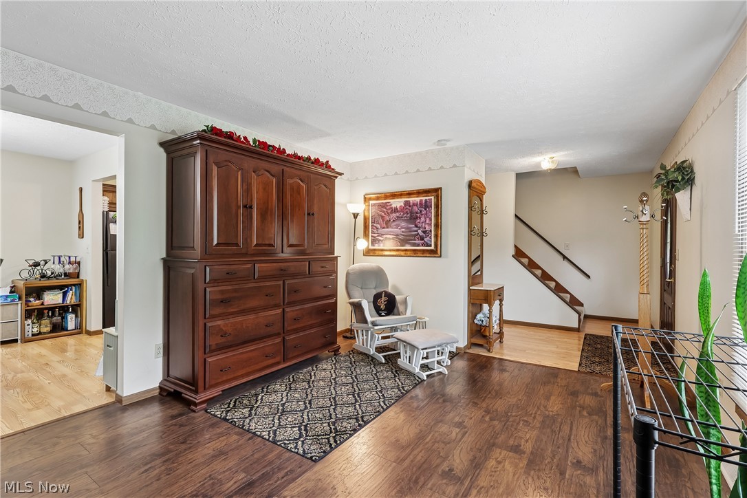 4702 Alger Road Richfield, OH 44286 - Photo 11 of 46 Living room showing foyer, front door entry and LVT flooring