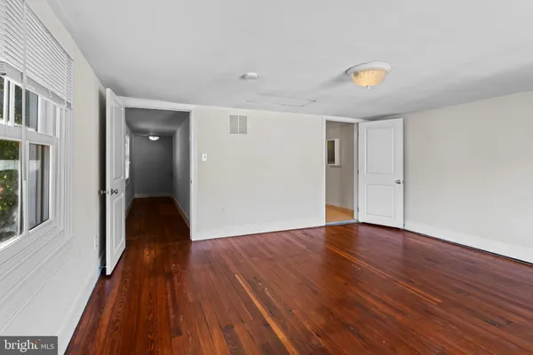a view of a livingroom with wooden floor