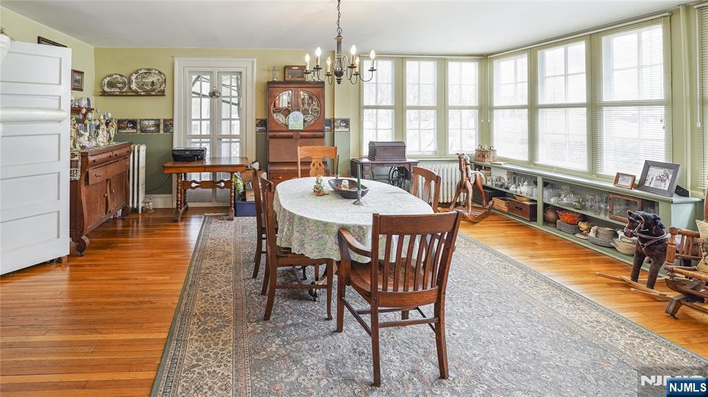 695 Ramapo Valley Road Oakland, NJ 07436 - Photo 19 of 42 a dining room with furniture window wooden floor