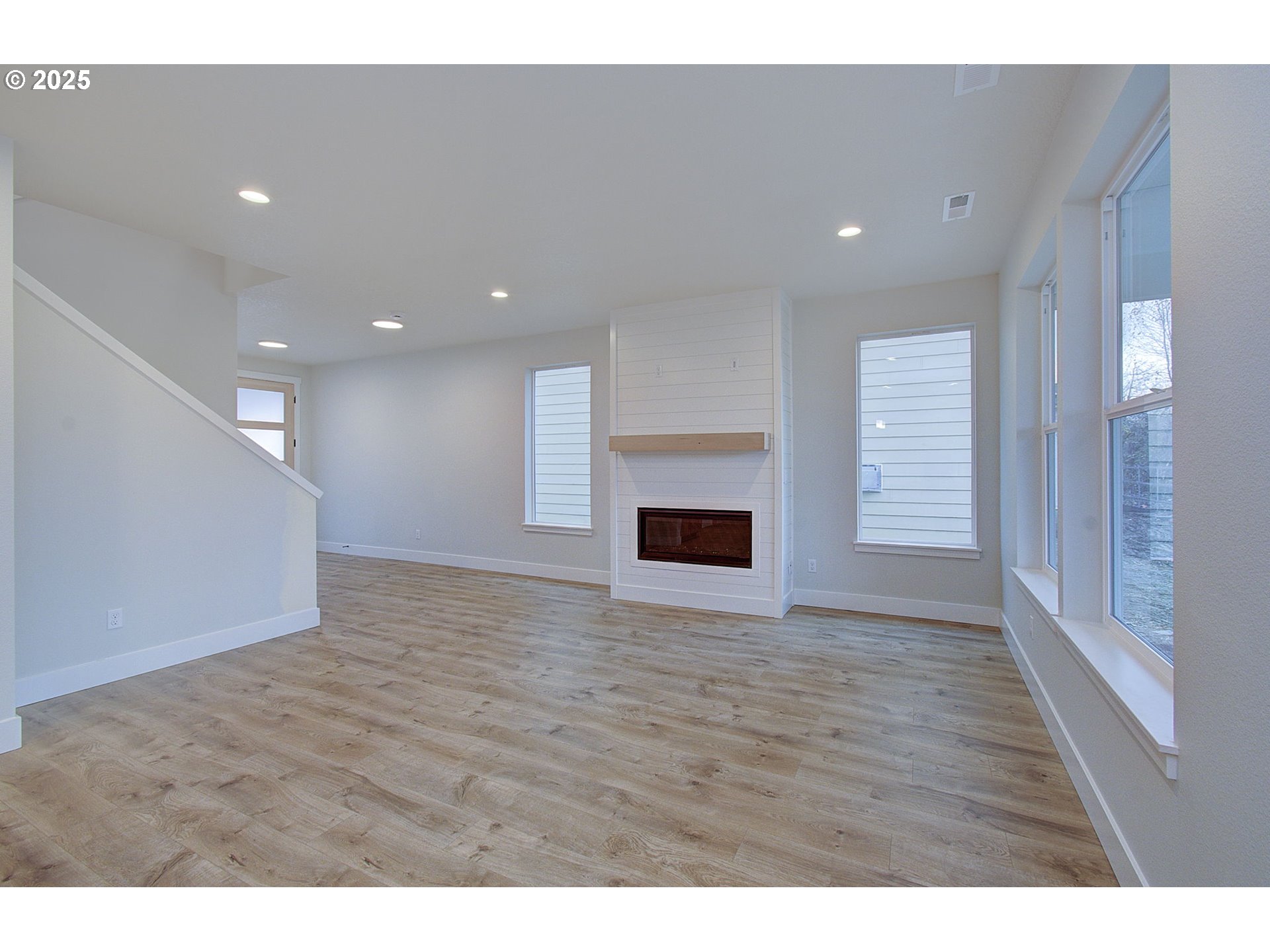 3404 Southeast 6th Avenue Battle Ground, WA 98604 - Photo 14 of 30 a view of empty room with wooden floor and fireplace