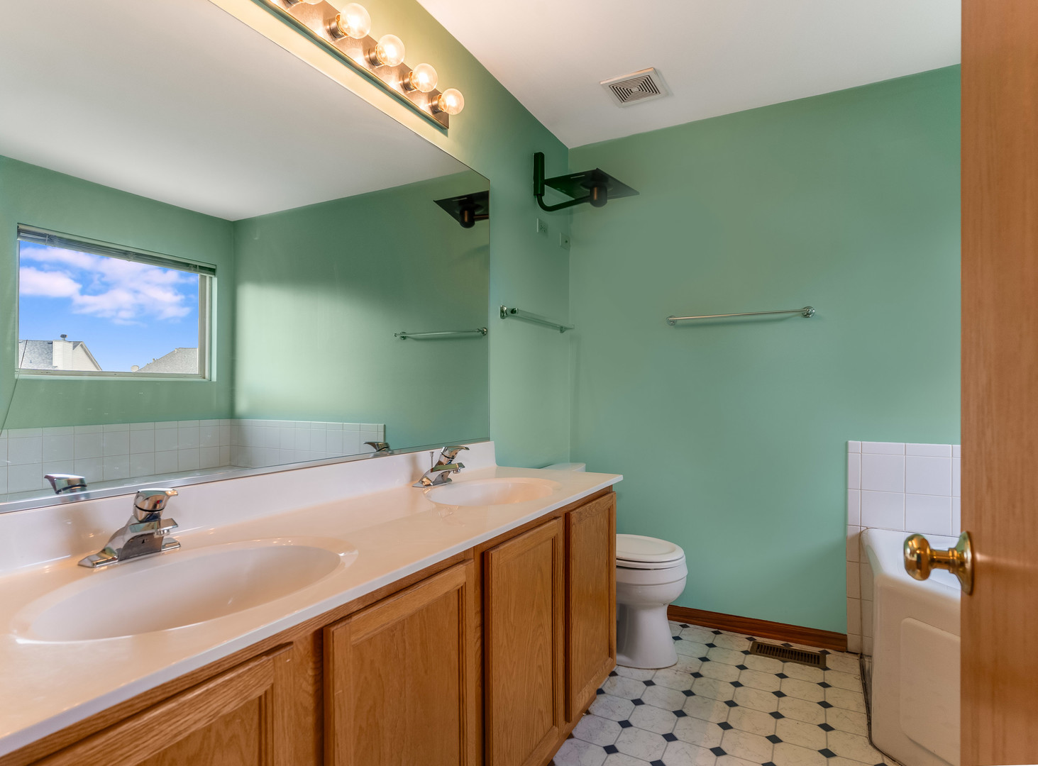 1910 Arbor Fields Drive Plainfield, IL 60586 - Photo 17 of 26 a bathroom with a sink a toilet a shower and a mirror