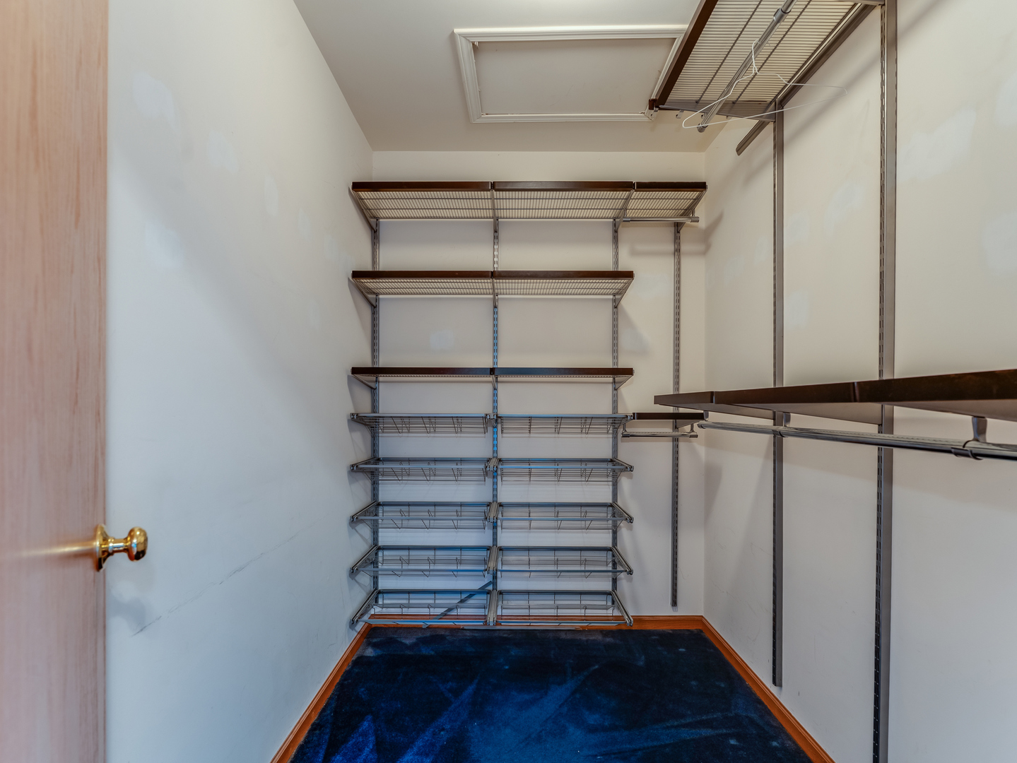 1910 Arbor Fields Drive Plainfield, IL 60586 - Photo 19 of 26 a view of a room with racks on the wall