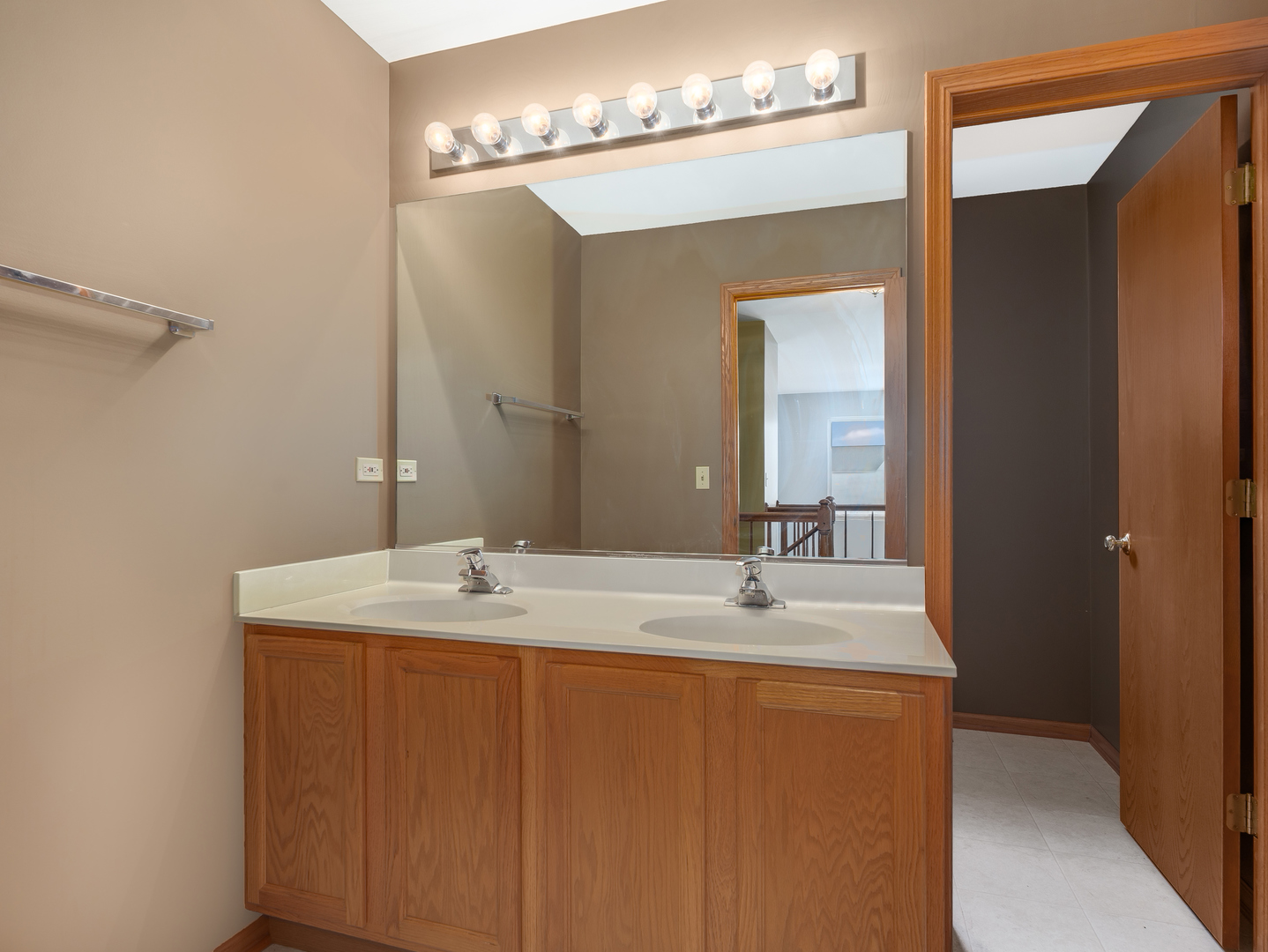 1910 Arbor Fields Drive Plainfield, IL 60586 - Photo 20 of 26 a bathroom with a sink and a mirror