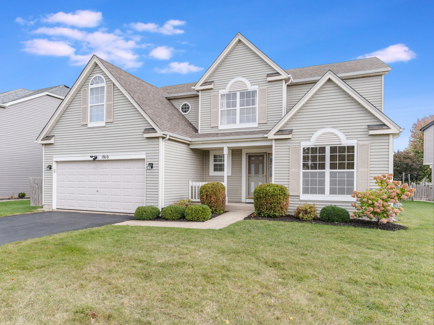 1910 Arbor Fields Drive Plainfield, IL 60586 - Photo 2 of 26 a front view of a house with garden