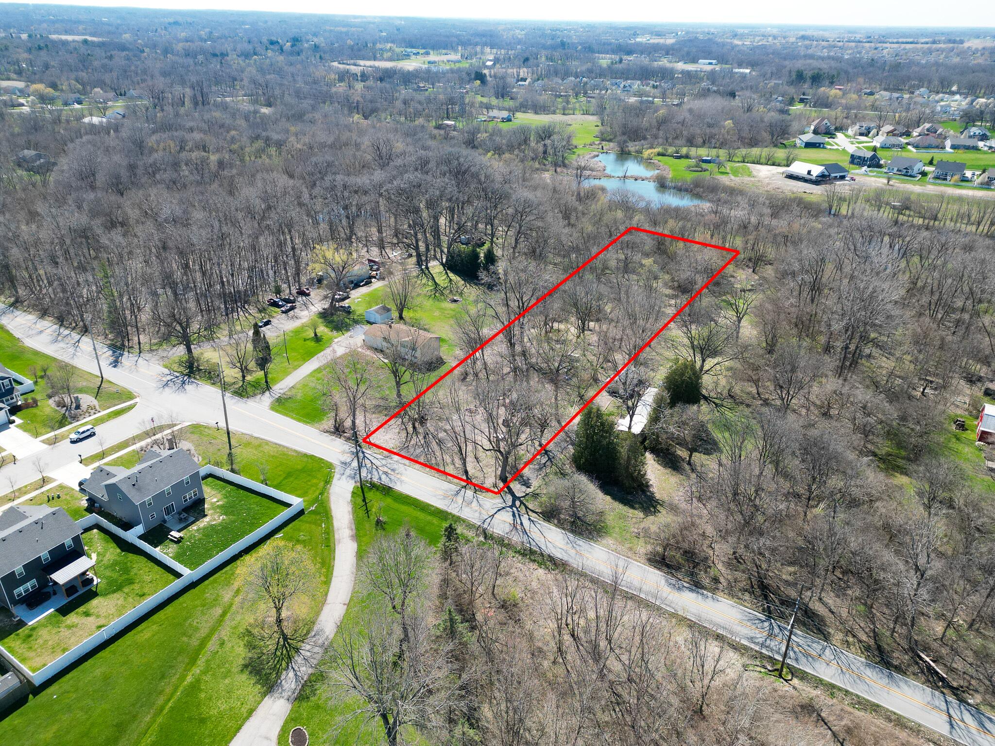 0 Tower Road Valparaiso, IN 46385 - Photo 1 of 15 an aerial view of a houses with a lush green forest