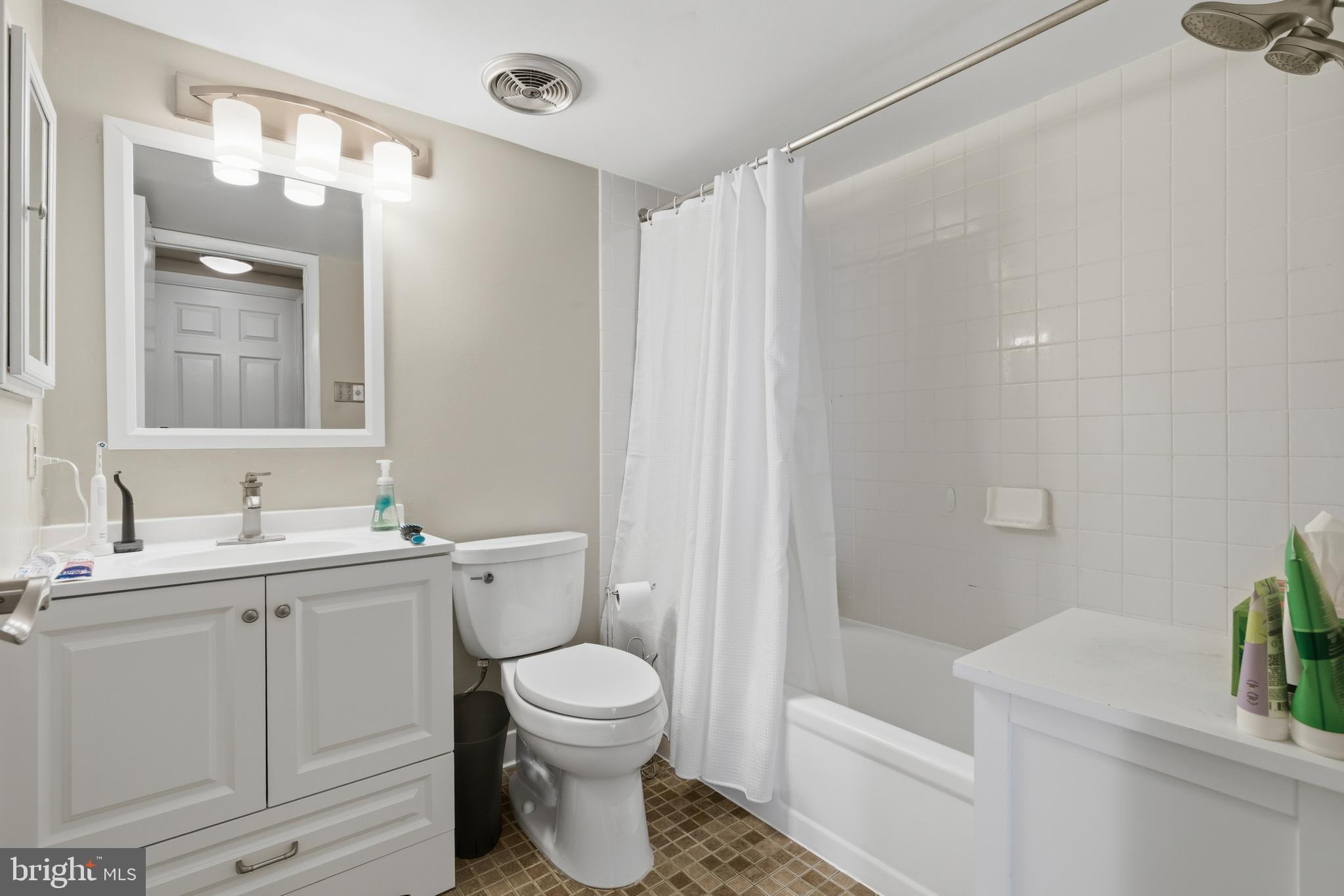 1245 13th Street Northwest, Unit 412 Washington, DC 20005 - Photo 9 of 13 Update bath w/ tub/shower and white vanity