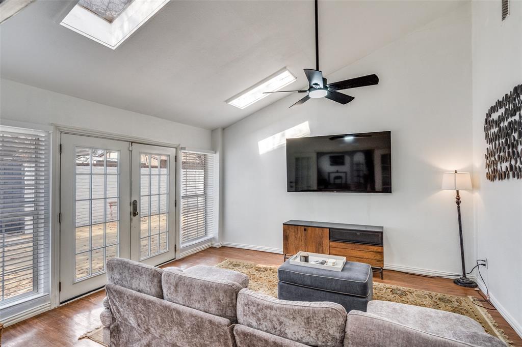15642 Overmead Circle Dallas, TX 75248 - Photo 12 of 24 a living room with furniture and a flat screen tv