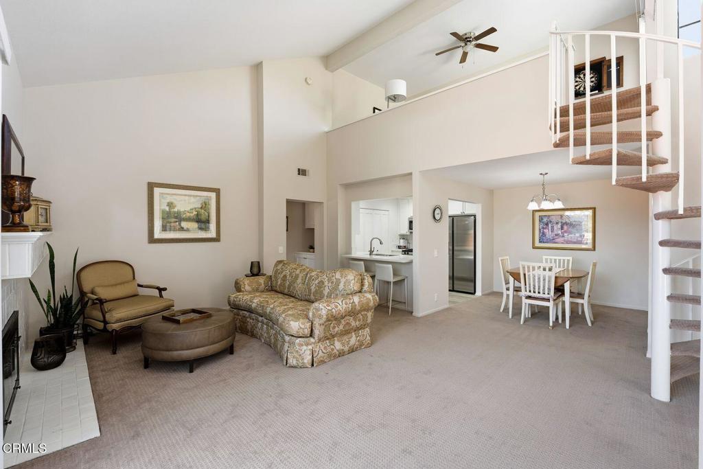 4427 Antigua Way Oxnard, CA 93035 - Photo 5 of 43 a living room with furniture a flat screen tv and a table